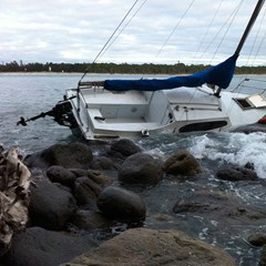 A 20ft yacht, Nivana, is badly damaged on the rocks of the western side of Mau&#257;o.